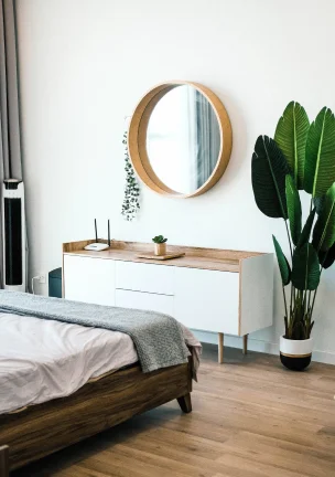 A sideboard in a nicely decorated bedroom