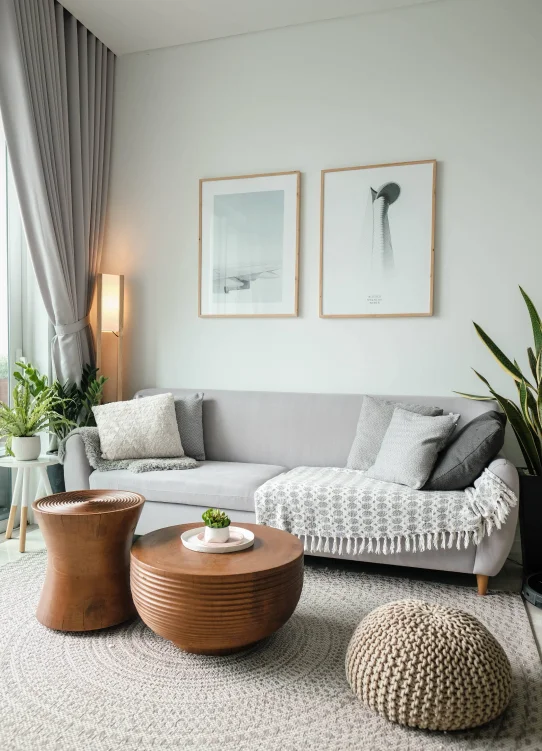 A grey couch in a nicely decorated living room